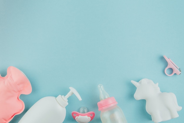 Toys and pacifier on a blue background