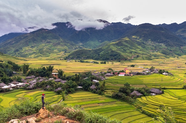 Traaveler take picture at Rice fields on terraced of Tu le District