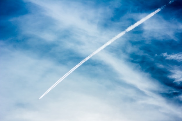 trace of an airplane against blue sky