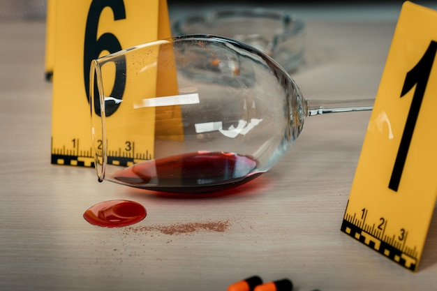 Photo traces found on a glass of wine an ashtray at the crime scene