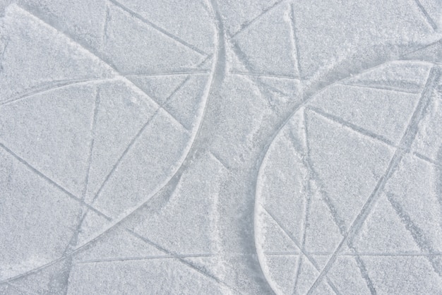 Traces on the ice from skates on the rink