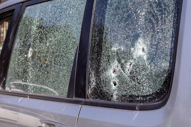 Traces of shots on the body of the car War between Russia and Ukraine Part of a civilian car that was fired upon during the evacuation of unarmed people from the combat zone