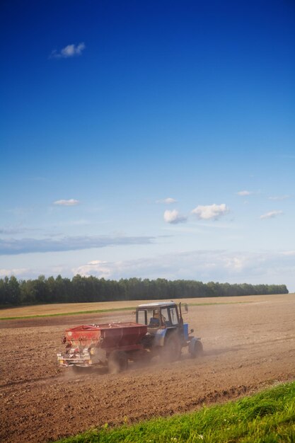 Tractor on the cultivated field