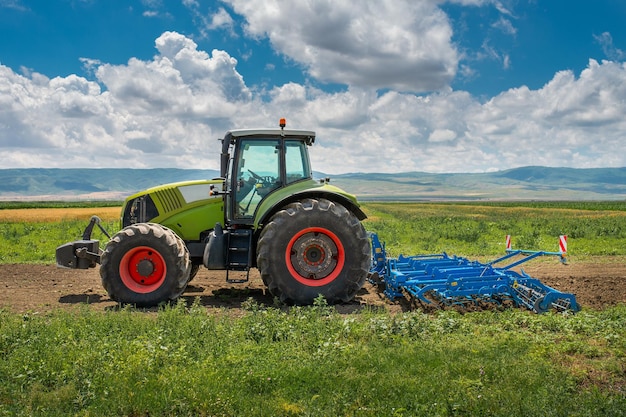 Photo tractor cultivates land