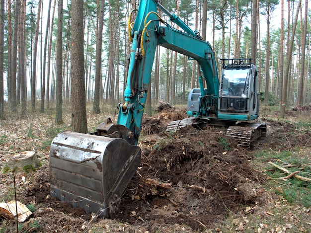 Tractor digging the ground with a bucket