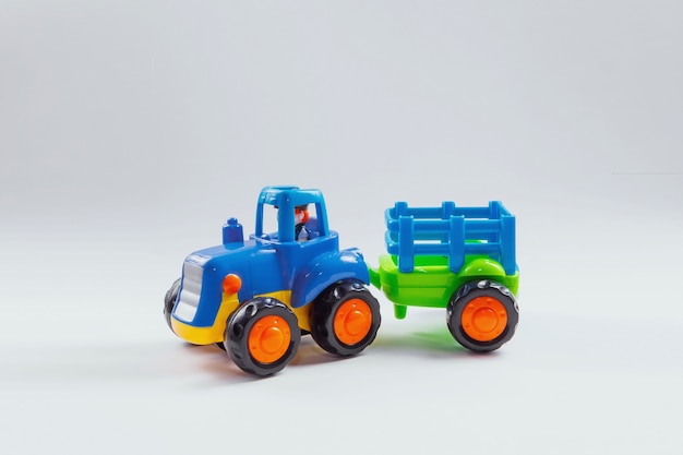 Tractor model with the trailer on a white 