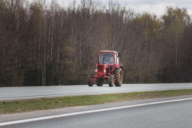 Tractor moving on highway, telephoto