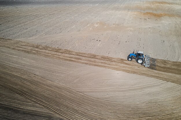 Tractor plows flight top view