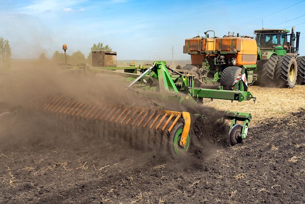 The tractor plows the land agriculture image