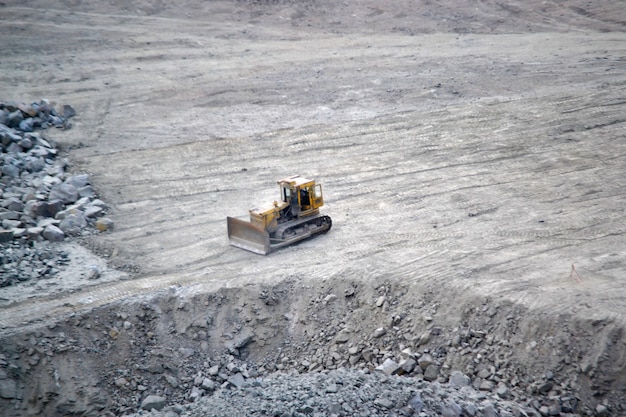 Tractor on the site of a granite quarry. view from aboveiew from above