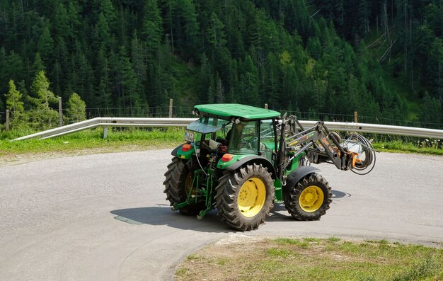 A tractor working in the fields high in the mountains