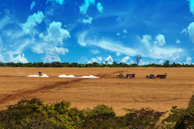 Tractors preparing the soil on the farm