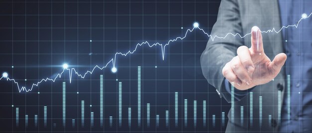 Trade and finance concept Businessman hand clicking on abstract glowing forex chart on dark background