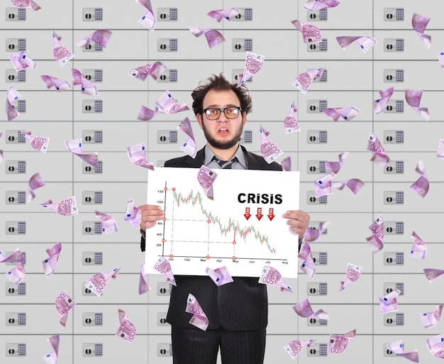 Trader holding poster with crisis chart