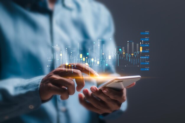 Trader use mobile smart phone with virtual screen of stock growth graph invest in trading planning and strategy Stock market Business growth progress or success concept