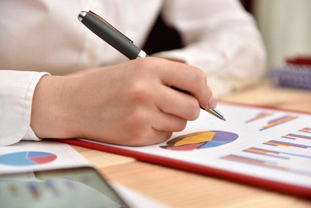 Trader Woman analyzing income graphs