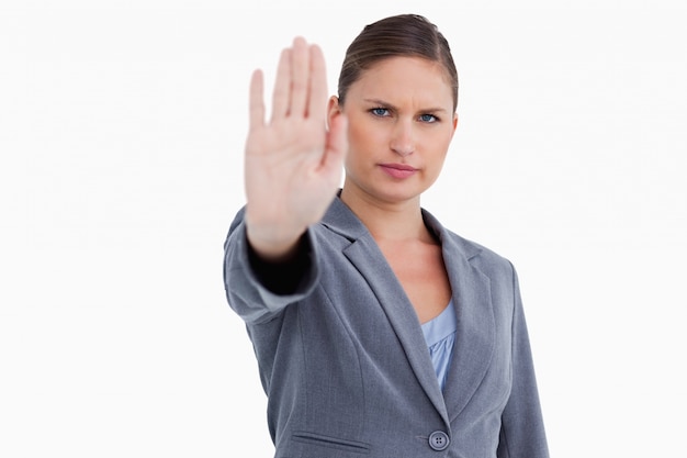 Tradeswoman signalizing stop