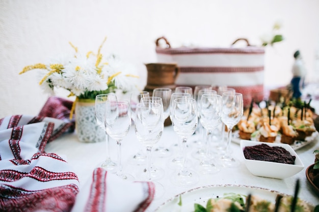 Traditional alcohol bar with snacks at the wedding ceremony