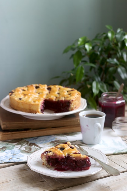 A traditional American or European cherry pie made of shortcake. Rustic style.