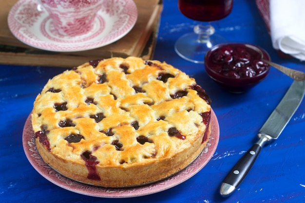 A traditional American or European cherry pie made of shortcake. Rustic style.