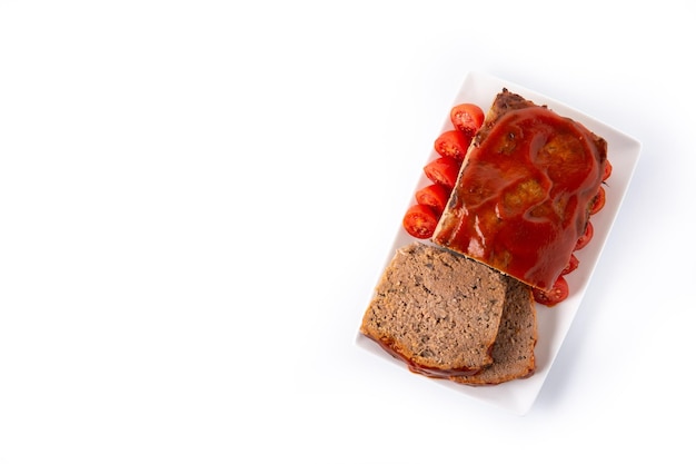 Traditional American meatloaf with ketchup isolated on white background