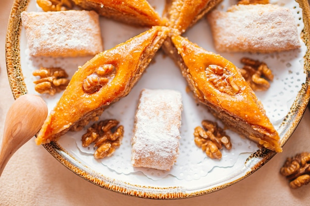 Traditional arabic dessert baklava with cashew, walnuts and cardamom with an eucalyptus