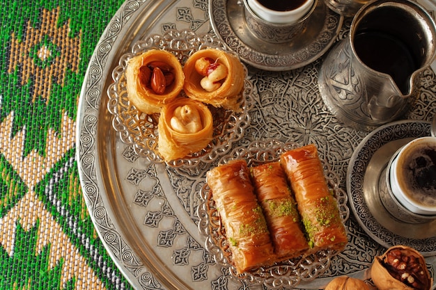 Traditional arabic dessert baklava with a cup of turkish coffee