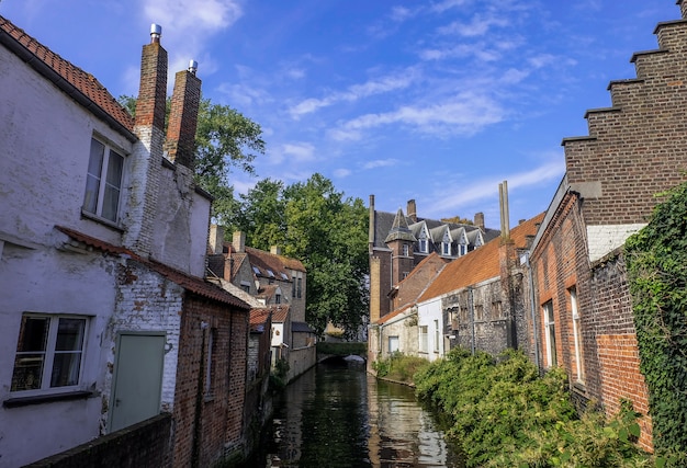 Traditional architecture building and canal in BruggeBelgium September 2017