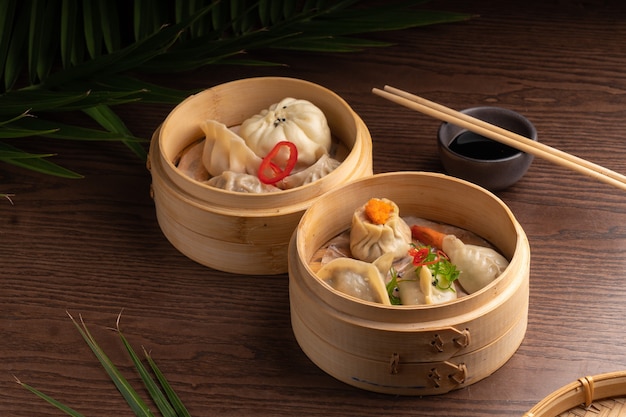Traditional Asian food dumpling in a bowl Hot dish dim sum served in a national wooden bowl