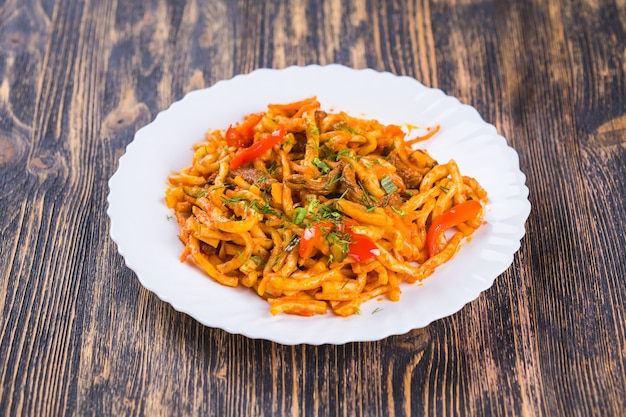 Traditional asian noodle lagman on a plate