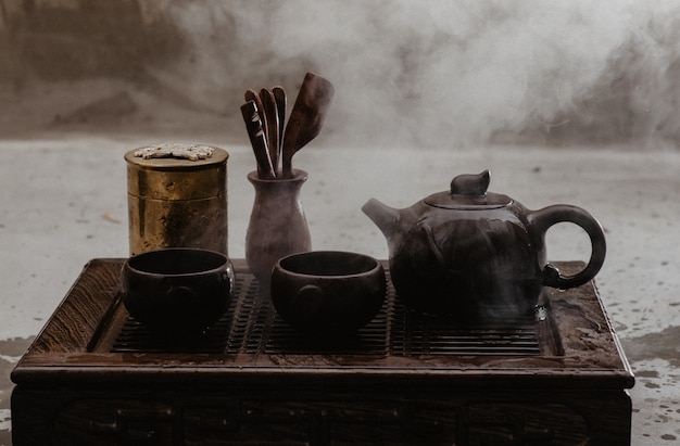 Traditional Asian tea ceremony arrangement. Iron teapot