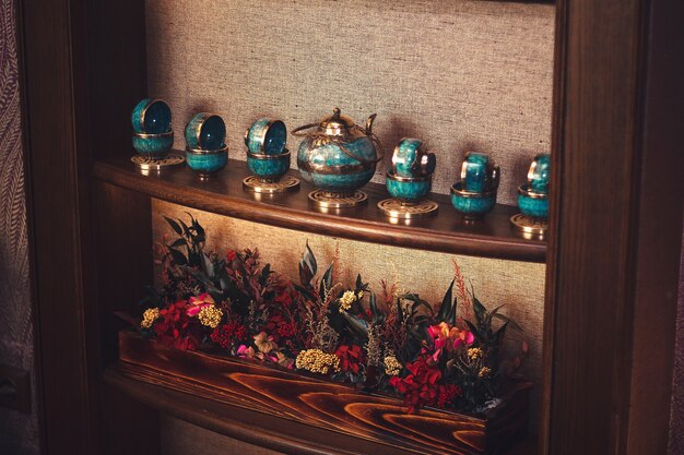 Traditional asian tea set on the shelf.