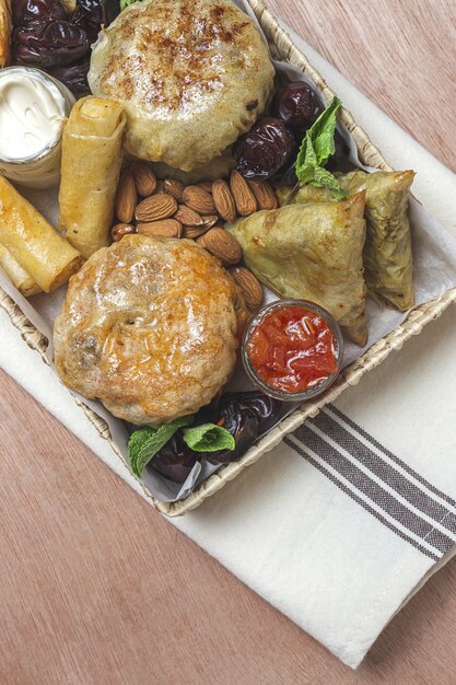 Traditional assortment of Arabic brunch snacks with almonds and dates. Moroccan food. Take away concept