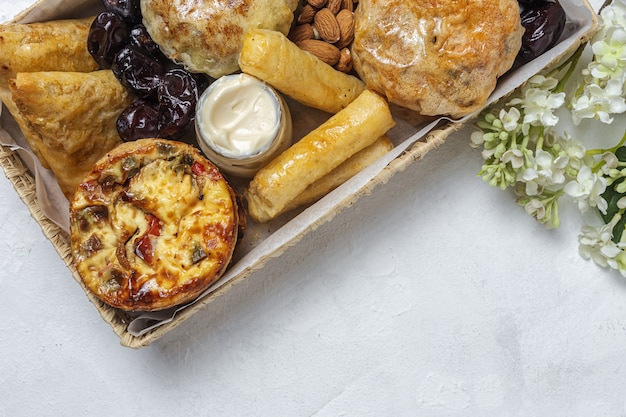 Traditional assortment of arabic food snacks with almonds and dates. moroccan food. street food concept