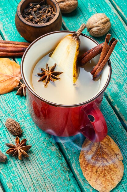 Traditional autumn alcoholic drink.Warm pear mulled wine.Pear wine with spices.