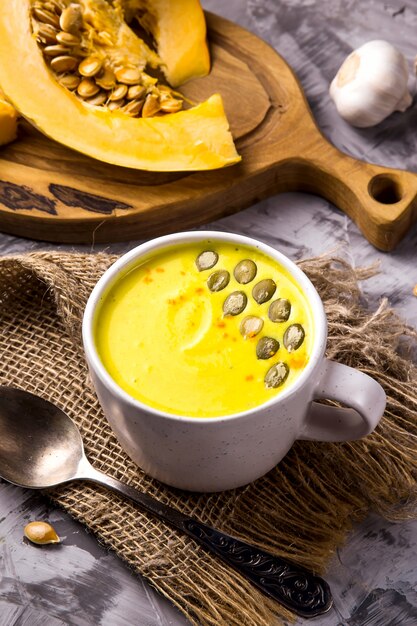 Traditional Autumn Pumpkin Dish - Soup with Spices and Garlic