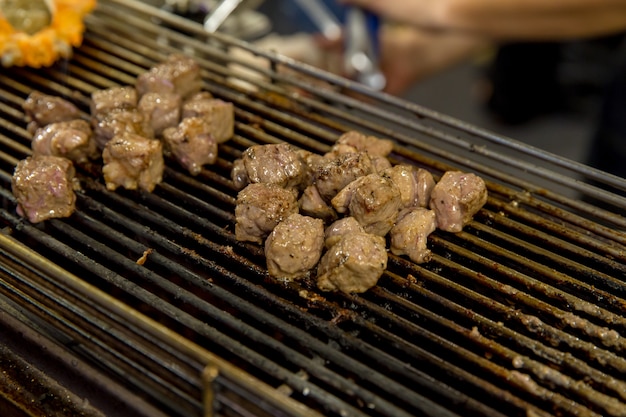 Traditional barbecue steak smoked pepper as close-up on the stove