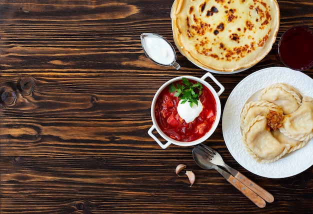 Traditional beetroot with pancakes and baked potatoes