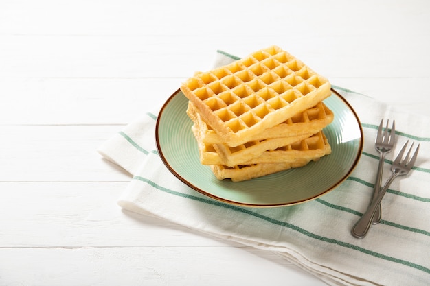 Traditional belgian waffles on a plate. Fast food