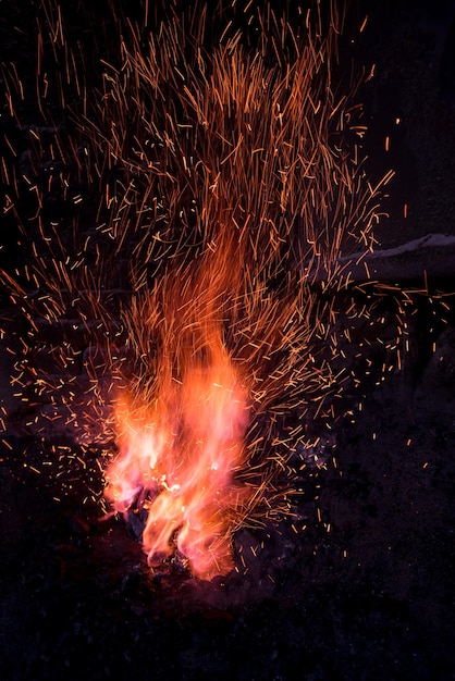 Traditional blacksmith furnace with burning fire
Burning fire in furnace at forge, workshop. Blacksmith equipment concept