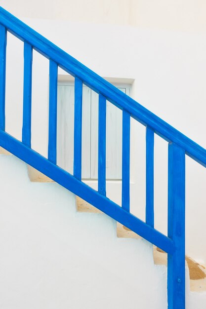 Traditional blue staircase with railing in Myconos Island, Greeece