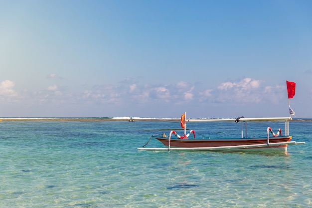 Traditional boat and tropical seascape at Pandawa beach, Bali