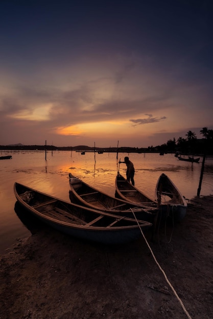 Traditional boats at O Loan lagoon in sunset Phu Yen province Vietnam