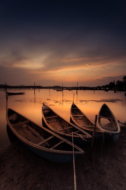 Traditional boats at O Loan lagoon in sunset Phu Yen province Vietnam