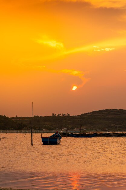 Traditional boats at O Loan lagoon in sunset Phu Yen province Vietnam