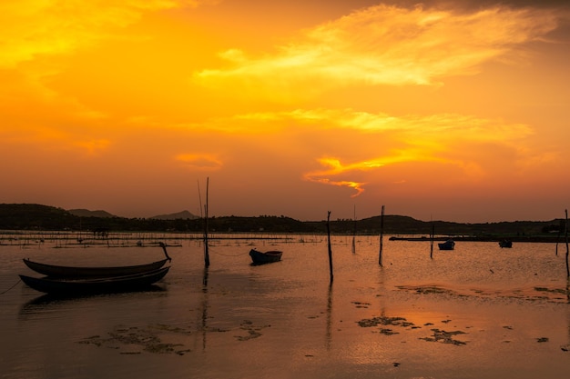 Traditional boats at O Loan lagoon in sunset Phu Yen province Vietnam