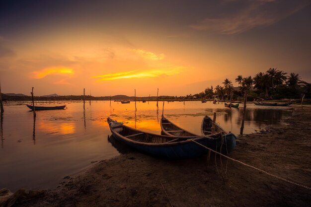 Traditional boats at O Loan lagoon in sunset Phu Yen province Vietnam