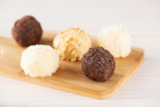 Traditional Brazilian candy brigadeiro truffles with chocolate cashew nuts and coconut