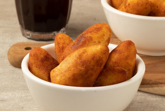 Traditional Brazilian snack coxinha with coffee