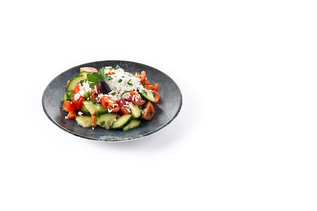 Traditional Bulgarian shopska salad with tomatocucumber and bulgarian sirene cheese isolated